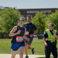 A participant crossing the street to finish up the race.